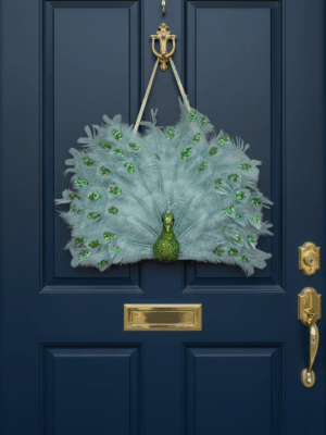 مجسم طاووس مزين بالريش - قطعة ديكور معلقة